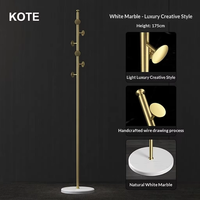 Porte-manteau sur pied KOTE Nordic Light Luxury en laiton et marbre, style moderne Instagram, pour chambre à coucher