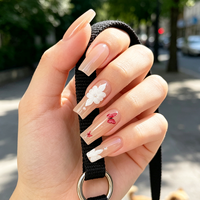 Faux ongles à presser longs forme cercueil, base nude, motif fleur blanche, papillon rouge, nœud perlé, réutilisables, vente en gros usine