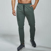 Pantalon de jogging élastique pour homme, motif uni, avec fermeture éclair, idéal pour le sport, la course, le football et l'entraînement en automne