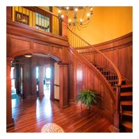 Escalier incurvé moderne de luxe avec main courante en verre et éclairage LED pour les maisons contemporaines Escaliers incurvés