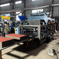 Machine de fabrication de blocs de briques Qt 10 15 grand modèle entièrement automatique au Ghana Machine à briques à imbriquer l'huile moteur en béton 12500kg