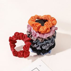 ยางรัดผมผ้าซาตินสีพื้นขนาดเล็ก 1.5 ซม. แบบบาง - Product Image 2