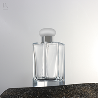 Bouteille de parfum de luxe transparente en verre givré noir de 50ml extrémité ouverte facile boîte de 100ml emballage bouteille de parfum en pierre luxueux