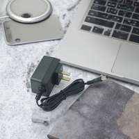 Adaptateur chargeur Li-ion 18V 1A DC avec connexion par prise en matériau PC, garantie 1 an, compatible prises US/UK/EU/AU/JP, alimentation électrique