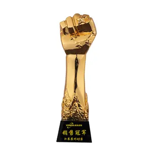 Yiwu Market Price Wholesale OEM Customized Logo Golden Fist Crystal Engraved Resin Plaques Trophy Resin For Competition Champion