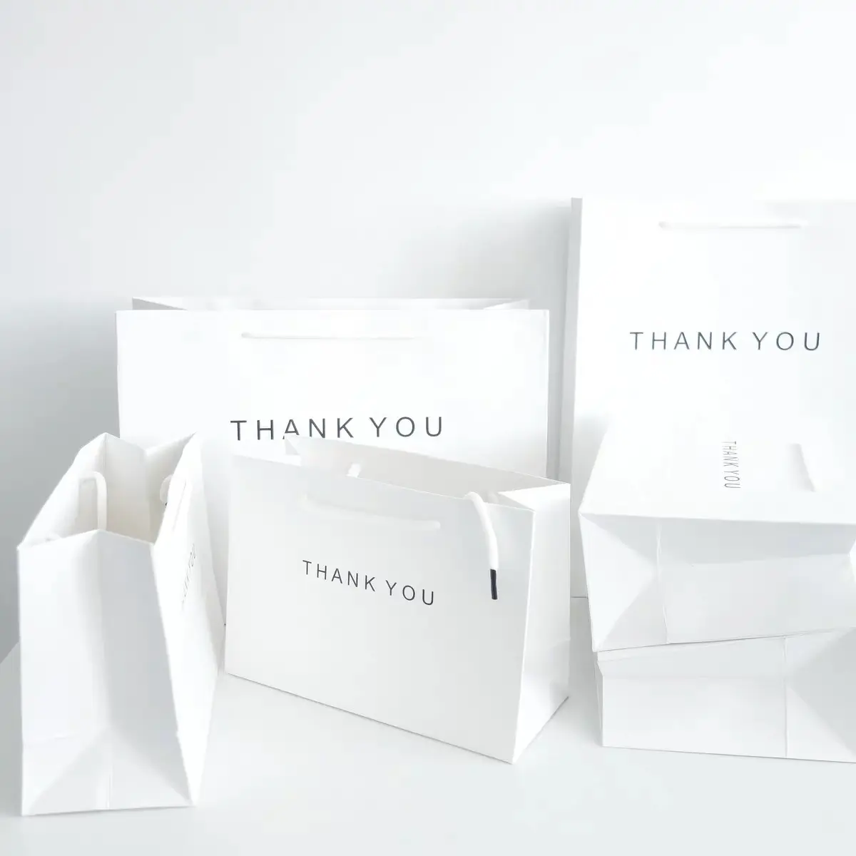 Personalizado branco graças você desenhar diferentes tipos de sacos de compras de roupas de papel com alça