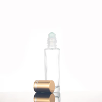 Flacon à rouleau en verre transparent de 15ml avec couvercle en or et rouleau en acier pour bouteille en verre à bille de parfum d'huile essentielle