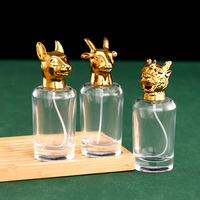 Flacon pulvérisateur de parfum vide en verre cylindrique 50 ml, qualité supérieure OEM ODM, avec capuchon tête d'animal et base lourde, pour échantillons de parfum, prix compétitif
