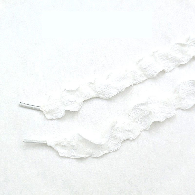 1 paire de lacets en maille à carreaux blancs