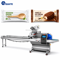 Équipement d'emballage de barres énergétiques aux biscuits au chocolat avec machine d'emballage rapide pour produits de collation