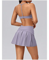 Ensemble 2 pièces pour femme : Soutien-gorge de sport dos nageur froncé à l'avant et jupe-short de tennis à taille drapée avec short intégré, pour le yoga et le golf