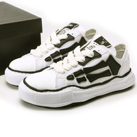 Chaussures en toile tendance à semelle effet fondu pour hommes et femmes, baskets épaisses à motif imprimé os, chaussures de couple rétro vintage pour le marché européen