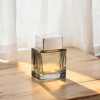 Bouteille de parfum en verre transparent de 50ml 100ml avec boîte OEM de forme unique rechargeable vide de luxe à sertir rectangle carré cube
