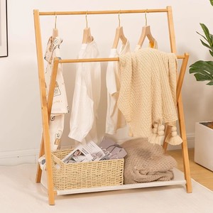 Simple and multifunctional <b>clothes</b> <b>rack</b> with cross-shaped design, perfect for bedside, bedroom, or children's use. - Product Image 2