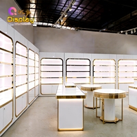 Vitrine murale moderne de luxe en acier inoxydable doré, écologique, de haute qualité, pour présentation de parfums, avec rétroéclairage LED et finition laquée blanche