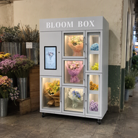 Vitrine de présentation de bouquets blanc-gris avec compartiments en verre et écran tactile pour distributeur automatique de fleurs