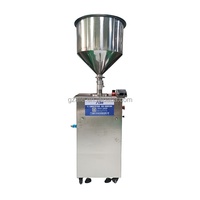 Machine de remplissage semi-automatique verticale pour liquides et crèmes, efficace et précise, 50ml, 100ml, 200ml, fournie directement par l'usine