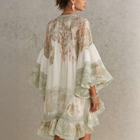 Robe asymétrique à volants imprimée vintage à manches cloche style occidental 2026