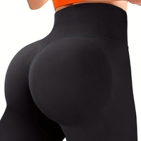 Legging yoga bentuk peach, pinggang tinggi, kontrol perut, warna solid, tanpa jahitan, membentuk tubuh, dan menonjolkan lekuk tubuh.