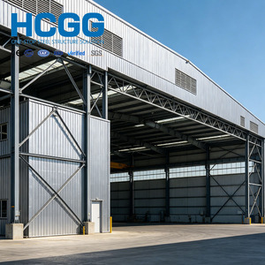 Hangar préfabriqué en structure d'acier avec poutres en H pour le stockage et l'entretien d'avions, de jets privés et de matériel aéroportuaire - Product Image 1