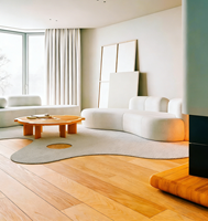 Canapé modulaire incurvé de luxe en cuir PU crème, style moderne et minimaliste, avec coussins ronds, pour salon, centre commercial et hôtel