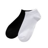 Chaussettes unisexes de haute qualité à prix de gros, logo personnalisé, couleur unie, chaussettes noires et blanches pour un usage quotidien