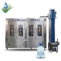 Machine de lavage, remplissage et bouchage rotative 3-en-1 pour bouteilles PET de petite taille, 600 BPH / 800 BPH, pour bouteilles de 7 L et 10 L