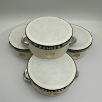 Vente en gros du tambourin en peau de mouton simili de 4 pouces, le plus vendu, pour l'accompagnement Orff et comme cadeau de mariage, à prix très raisonnable.