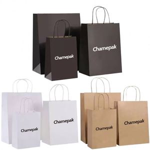 ถุงกระดาษคราฟท์สีน้ำตาลรีไซเคิลได้สำหรับขายส่ง พร้อมริบบิ้นพิมพ์โลโก้ตามสั่ง สไตล์คลาสสิกหรูหรา สำหรับบรรจุภัณฑ์เสื้อผ้า ใช้สำหรับโปรโมชั่น - Product Image 1