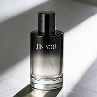 Vente en gros d'usine, flacon de parfum en verre vintage à logo personnalisé, dégradé de couleurs, cylindrique, fond épais noir, vaporisateur à pompe, écologique