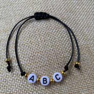 Bracelets noués tressés colorés divers lettre perle cire <span class=keywords><strong>corde</strong></span> Paracord un Dollar magasin mode chaîne Bracelets <span class=keywords><strong>corde</strong></span> rouge - Product Image 5