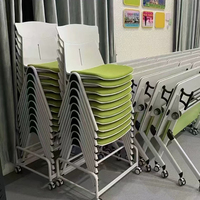 Chaise de formation empilable en plastique avec dossier et coussin en tissu, chaise de visiteur de bureau ergonomique avec cadre blanc et assise rembourrée en tissu orange