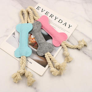 Venta al por mayor fieltro perro mordedura juguete mascota masticar hueso juguetes fieltro tela colorida duradera perro cuerda Juguetes - Product Image 1