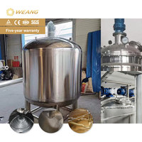Machine de remplissage de liquides semi-épais (miel) avec réservoir de mélange de 1000 L et système de pesage à double tête
