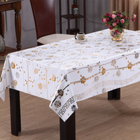 Nappe en vinyle florale RNPT avec imprimé feuilles or et argent bicolore, bordure rayée et support en tissu pour la salle à manger