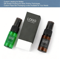 Bouteilles en plastique PET vert ambre de petite capacité 10 ml, forme cylindrique, bouchon à vis, vaporisateur à fine brume, sérigraphie, liquide cosmétique
