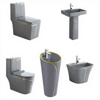 Ensemble de sanitaires en céramique gris pour salle de bain : lavabos sur pied et WC monobloc