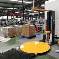 Machine d'emballage de palettes TP1650 entièrement automatique avec moteur de pressage supérieur, capacité de 550 kg, dimensions d'emballage extensible à chargement par le haut