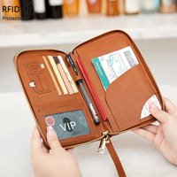 Nouvel étui de passeport RFID et organiseur de billets, étui de passeport avec fermeture éclair longue, sac de voyage multifonctionnel pour passeport