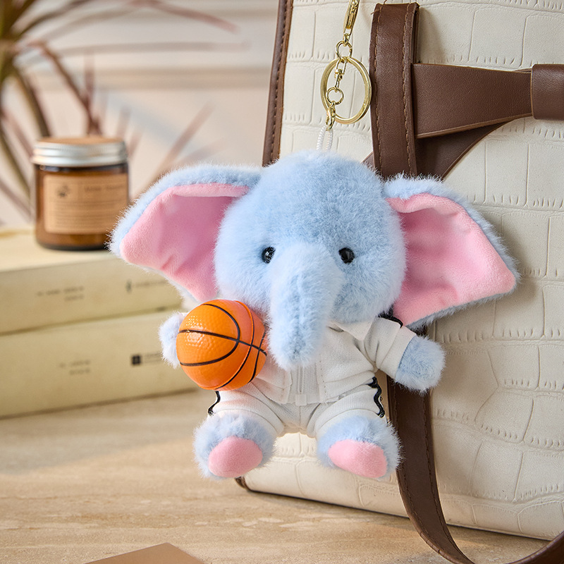 Traje deportivo blanco - pelota azul - elefante