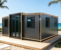 Maison de plage modulaire moderne avec éclairage LED, cadre noir, extérieur anthracite, petite maison front de mer, villa, complexe hôtelier, installation rapide