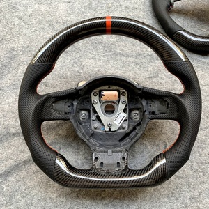 CCE Volant en fibre de carbone Offre Spéciale pour <span class=keywords><strong>Audi</strong></span> 2008 <span class=keywords><strong>TT</strong></span> R8 Anneau <span class=keywords><strong>rouge</strong></span> en cuir perforé Accessoire de voiture - Product Image 1