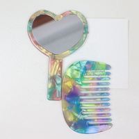 Mignon peigne à cheveux portable en acétate vintage en forme de cœur avec miroir intégré pour femmes