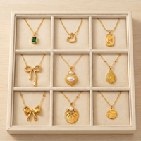 Collier pendentif en acier inoxydable plaqué or pour femme, étanche, inaltérable, avec nœud délicat, perle, cœur et pierre verte, vente en gros