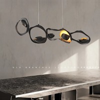 Lustre moderne de restaurant de bande d'art de concepteur lumières ovales haut de gamme pour l'éclairage créatif de style nordique de barre d'hôtel