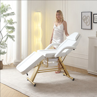 Table de massage électrique multifonctionnelle portable en cuir synthétique noir, pliable et réglable, pour salon et salle de bain, style luxe moderne
