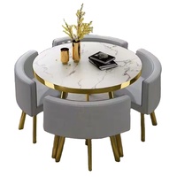 Ensemble de table à manger ronde moderne en marbre avec 4 chaises en cuir orange et pieds en métal doré pour salle à manger et décoration intérieure
