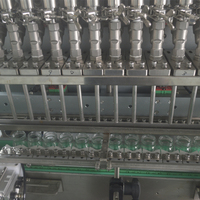 Prix usine Machine de remplissage à 12 têtes anti-éclatement de type suivi pour miel, sauces, yaourt, nid d'oiseau