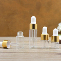 Vente en gros de flacons compte-gouttes en verre ambré transparent personnalisés avec couvercle doré, flacon en verre pour huile essentielle, sérum cosmétique, pipette
