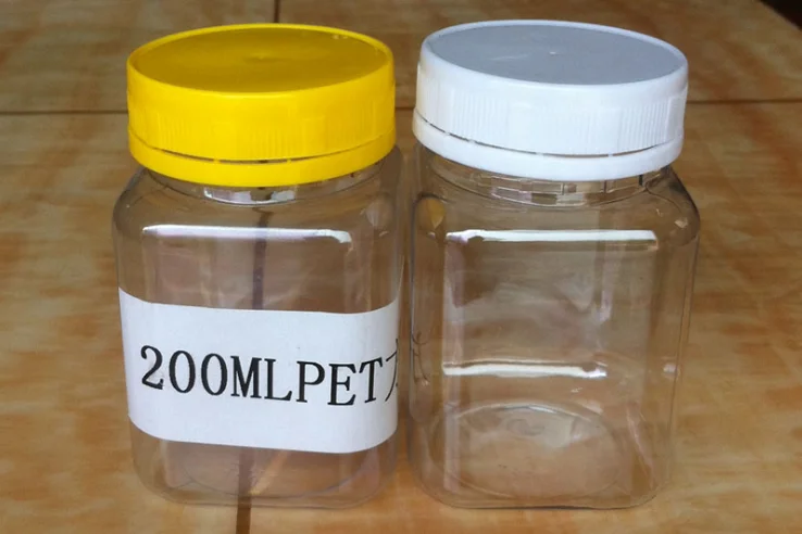 Quadratisches Glas leeren honigglasbehälter 250g 500g 1000g Plastikklaren Haustieres mit offensichtlichem Deckel des Besetzers